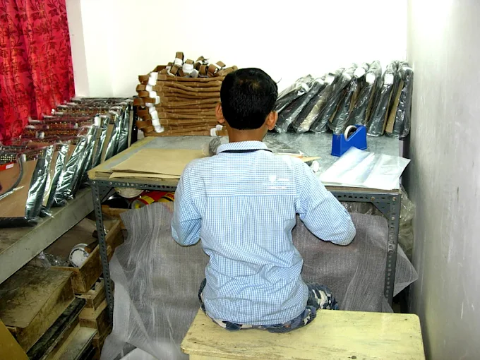Artisans preparing materials in the Kolkata workshop